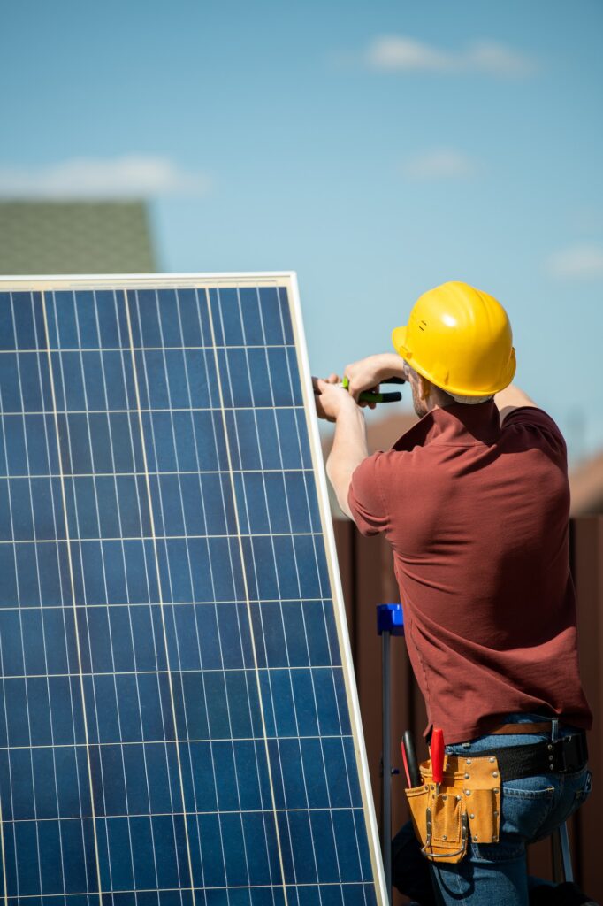 Worker Installing Photovoltaic Panel
